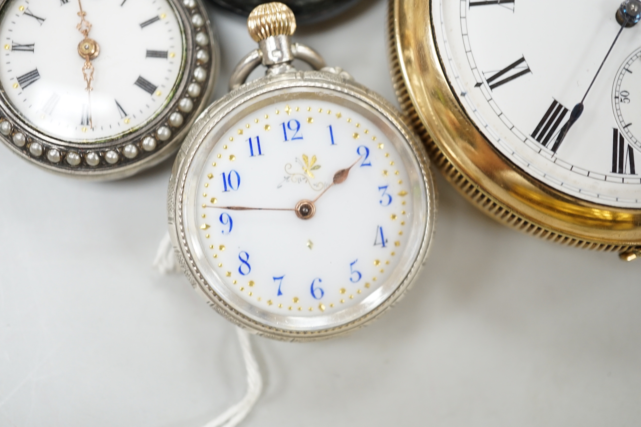 A gold plated open face pocket watch, a silver wrist watch, three fob watches including Art Nouveau 935 and enamelled and a globe watch.